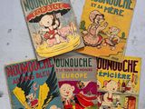 quatre bandes dessinées sont posées sur une surface blanche