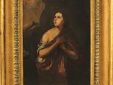 une peinture à l'huile représentant une femme tenant un bébé dans ses bras