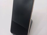 a cell phone that is sitting on top of a stand