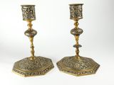 pair of antique brass candlesticks with ornate design