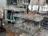 many glasses on the shelves in the room