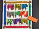 a colorful scarf with a tag on it and a tag attached to it
