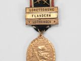 an image of a gold medal with a black ribbon around it