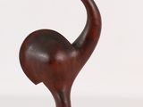wooden sculpture of an ostrich on a wooden base