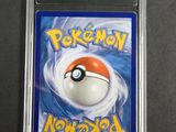 a close up of a pokemon card in a plastic case