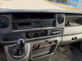 a dashboard of a car with a steering control