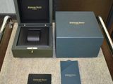 a box with a watch inside of it on a table