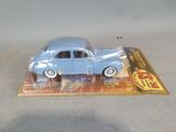 a toy car that is sitting on top of a card