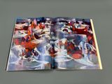 an open book with a picture of people on a beach