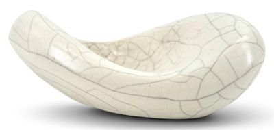 a white bowl that is sitting on a white surface