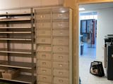 a room that has a bunch of shelves in it