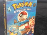a box of pokemon trading cards sitting on a table