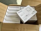 many boxes of electronic devices in a box on the floor