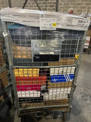 a cart with many boxes on it in a warehouse