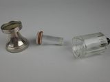 a small glass cup and a small glass cup on a table