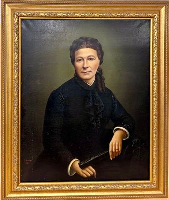 portrait of a woman in a black dress holding a cane