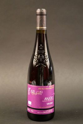 a bottle of wine that is sitting on a table
