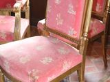 two chairs in a room with a rug on the floor