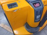 a yellow machine that is sitting on a pallet
