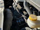 a car that has a broken hood and engine in it