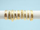 an image of a close up of a gold ring on a rope
