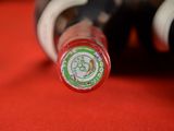a close up of a bottle of wine on a table