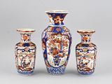 three vases sitting next to each other on a table