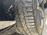 a close up of a car tire on the side of the road