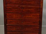 an antique wooden chest of drawers with three drawers on each side