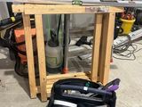 an image of a garage with tools on the floor