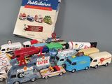 a lot of toy cars and a book on the table