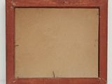 an old picture frame with a piece of brown paper in it
