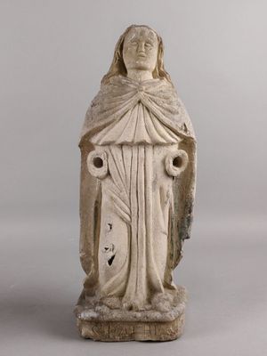 an old statue of a woman with a veil on her head