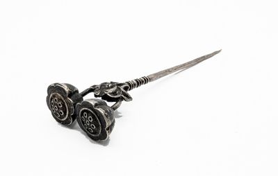 pair of antique silver plated scissors on a white background