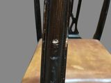 an image of a wooden chair with a leather seat