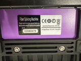 a close up of a purple and black box with a label on it