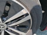 a close up of a tire on a red car