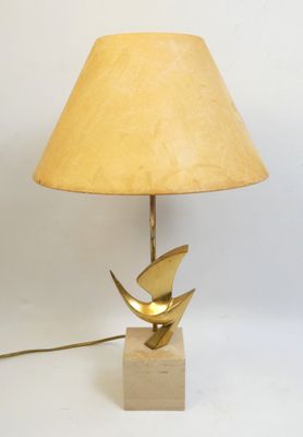 an image of a lamp with a bird on top of it