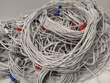a pile of wires on a white counter top