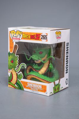 Figurine Funko Pop en vinyle représentant un dragon vert, dans sa boîte