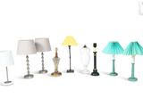 a lot of different lamps that are on a white surface