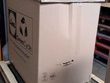 a cardboard box sitting on a pallet in a warehouse