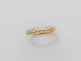 an 18k gold and diamond five stone ring