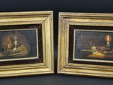 paire de peintures à l'huile représentant une nature morte avec une bougie et des fruits