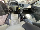 a picture of the interior of a car with a steering wheel