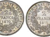 a silver coin with a wreath on the reverse side