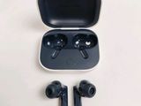 an image of a pair of earphones sitting on top of a white table