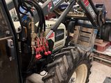 a tractor that is parked in a garage