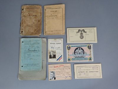 some old papers are sitting on top of a blue table