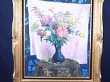 une peinture de fleurs dans un vase sur un chevalet
